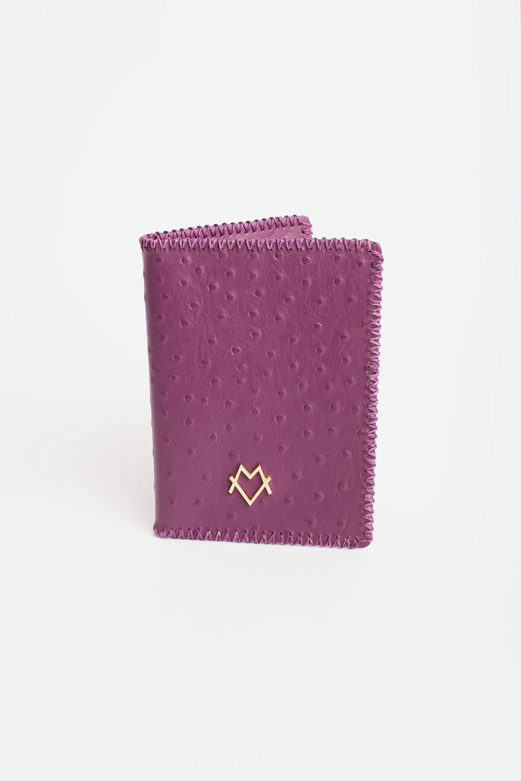 Tarjetero de pasaporte en morado (piel gofrada de avestruz)
