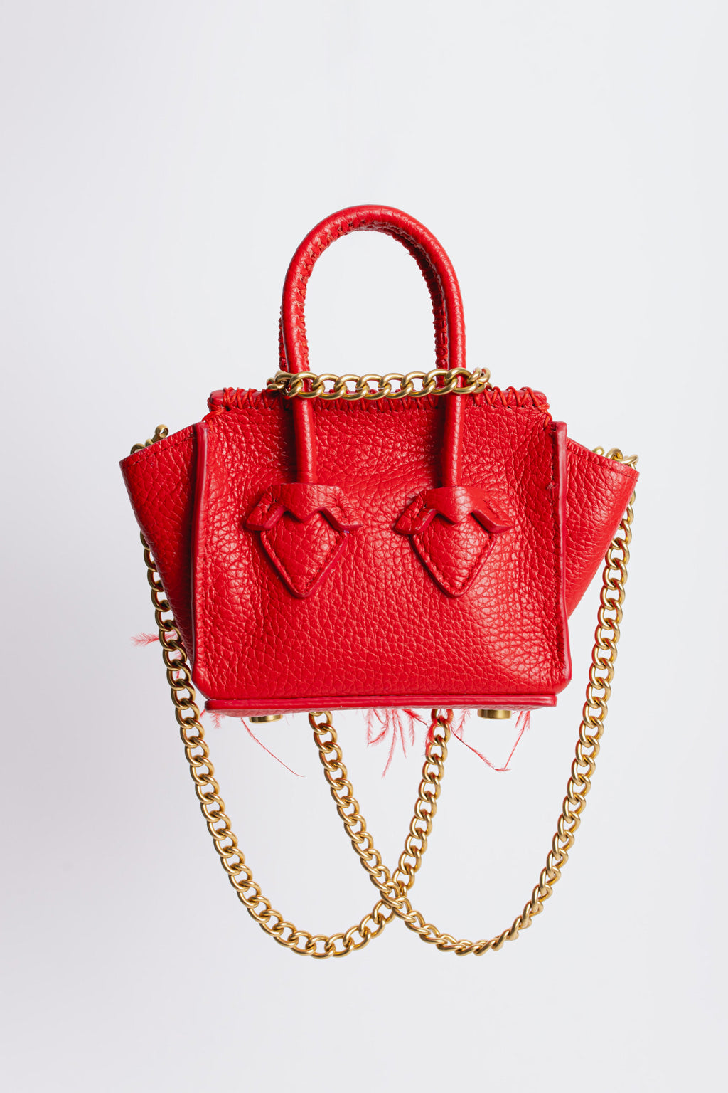 La Bebe in Red with feathers