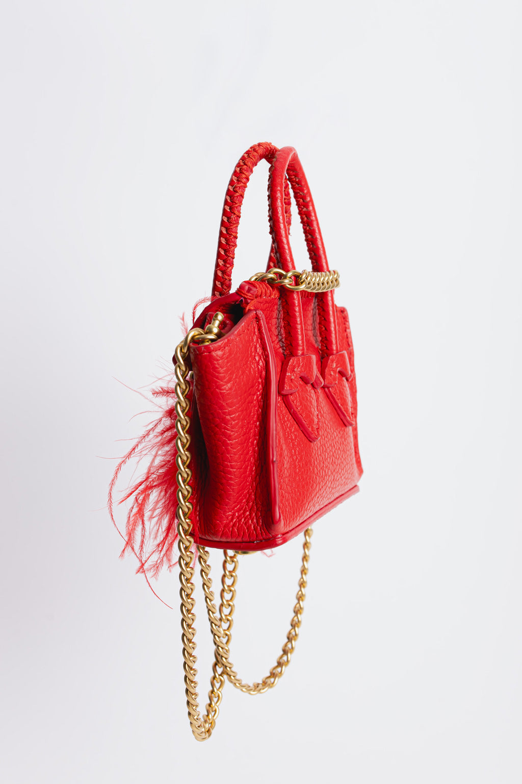 La Bebe in Red with feathers