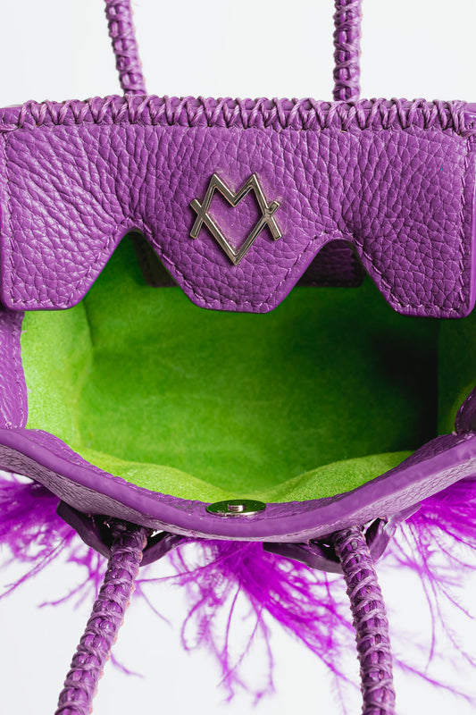 La Bebe in Purple with feathers