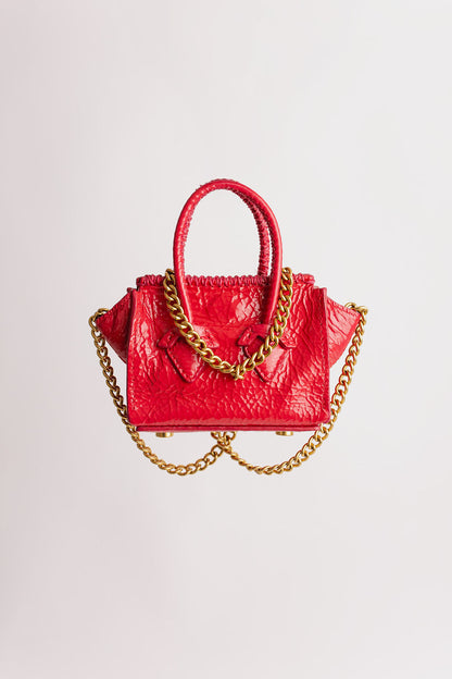 La Bébé en cuir verni fuchsia