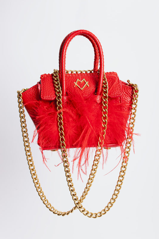 La Bebe in Red with feathers