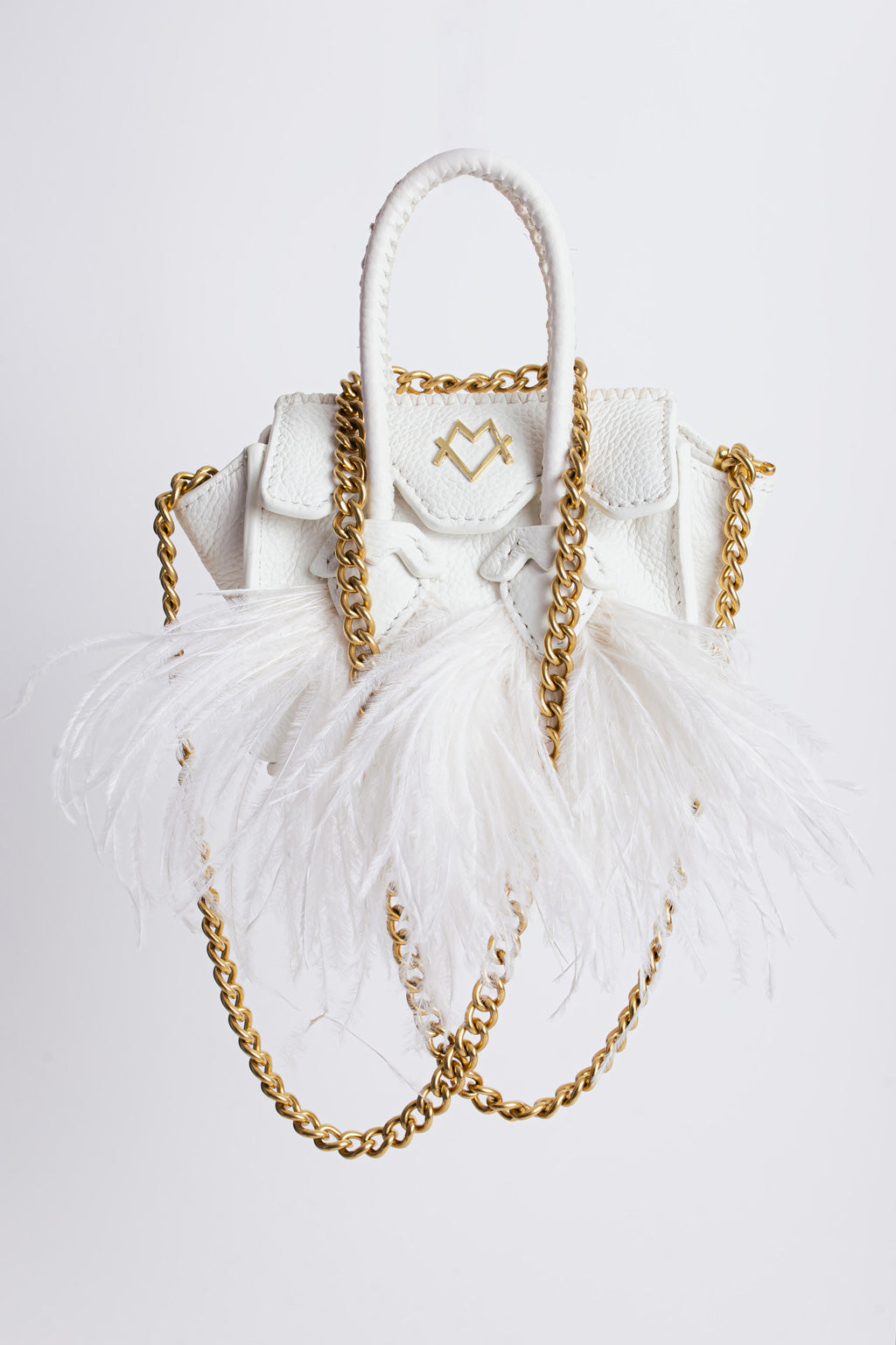 La bebe in white with feathers