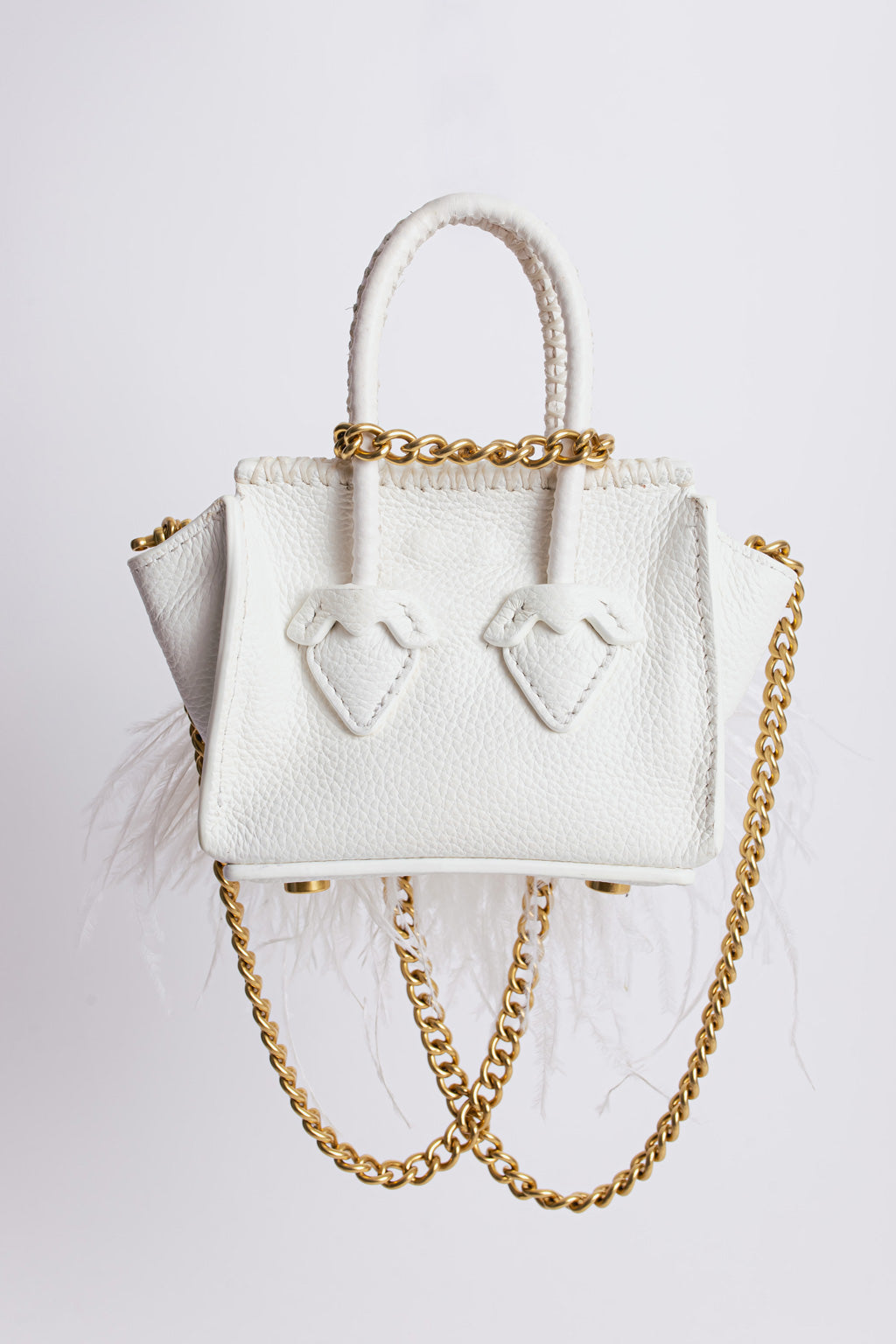 La bebe in white with feathers