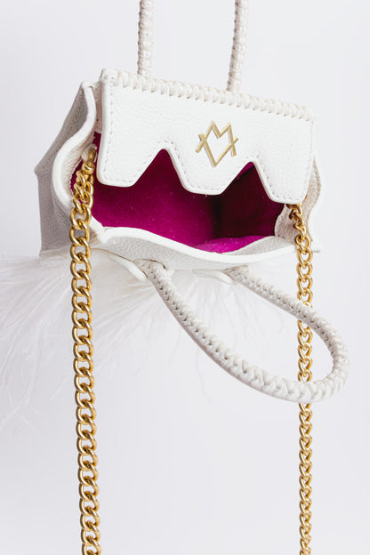 La bebe in white with feathers