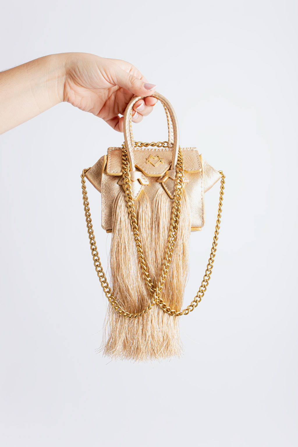 La bebe en Dorado with tassels