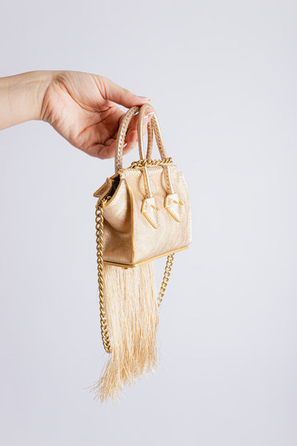 La bebe en Dorado with tassels