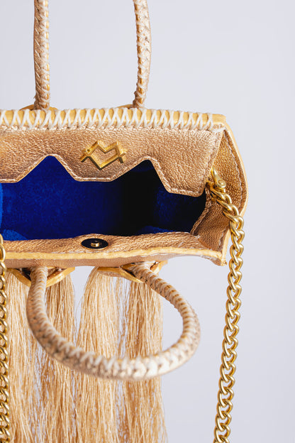 La bebe en Dorado with tassels